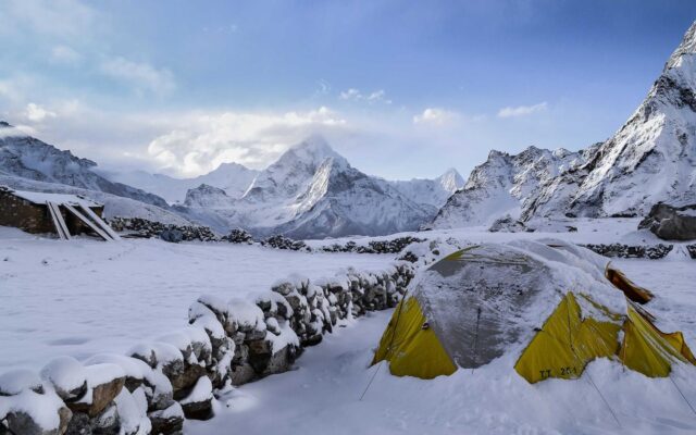 A winding trail leading toward distant mountain peaks